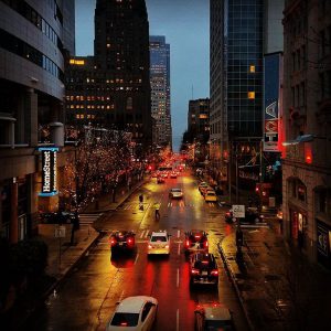 High angle shot of a Seattle street at dusk while raining.